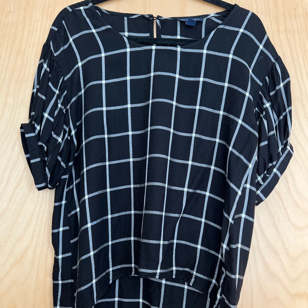 Saks 5th Ave high-low blouse with checkered pattern, prime for summer workdays.